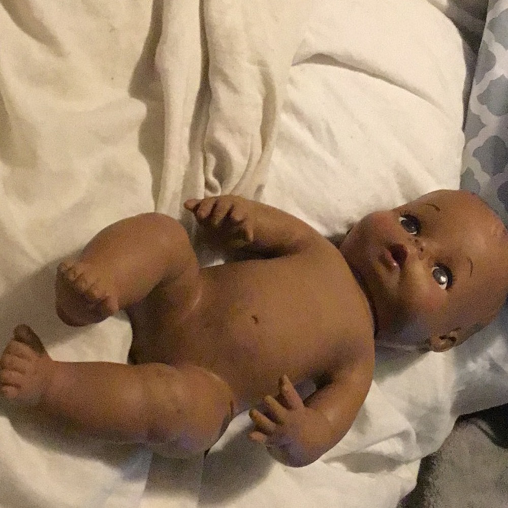 Black rubber doll  Moulded hair. 8126 Rattle